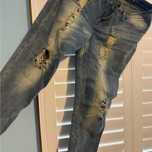 Blue Straight Leg Jeans with Distressed Details